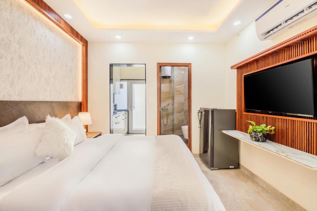 Postel nebo postele na pokoji v ubytování Kyomi Service Apartments