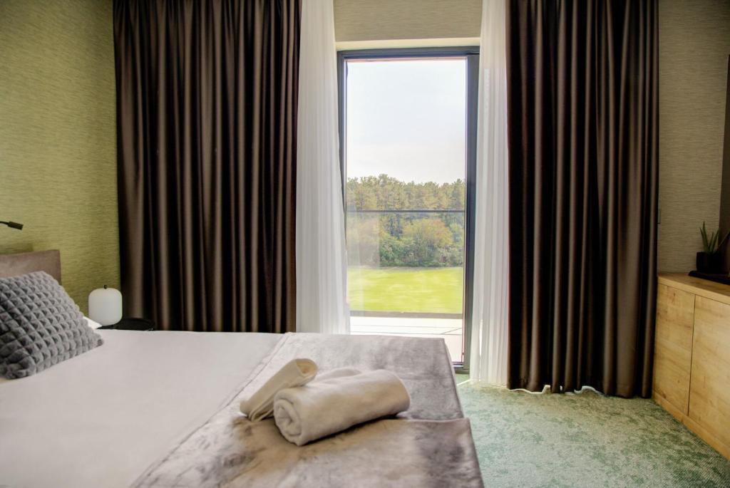 Postel nebo postele na pokoji v ubytování Hotel Experience