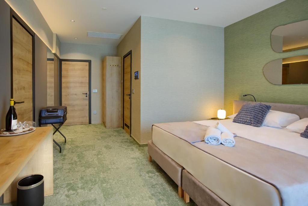 Postel nebo postele na pokoji v ubytování Hotel Experience