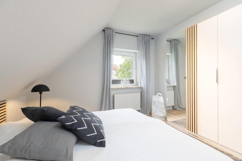 Postel nebo postele na pokoji v ubytování Appartement Nele Kieler Straße 16a APPARTO Grömitz