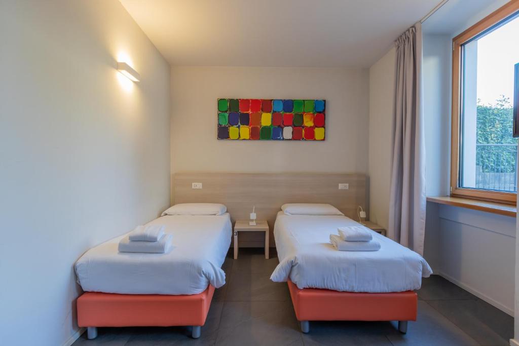 Postel nebo postele na pokoji v ubytování StraVagante Hostel & Rooms