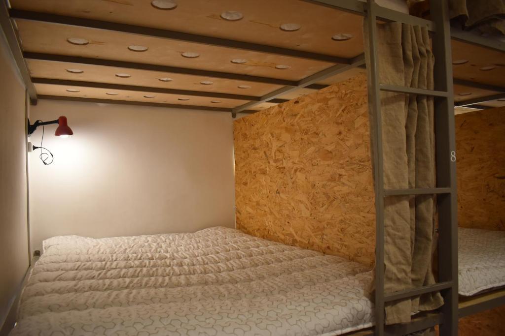 Postel nebo postele na pokoji v ubytování SLEEP STUDIO Hostel