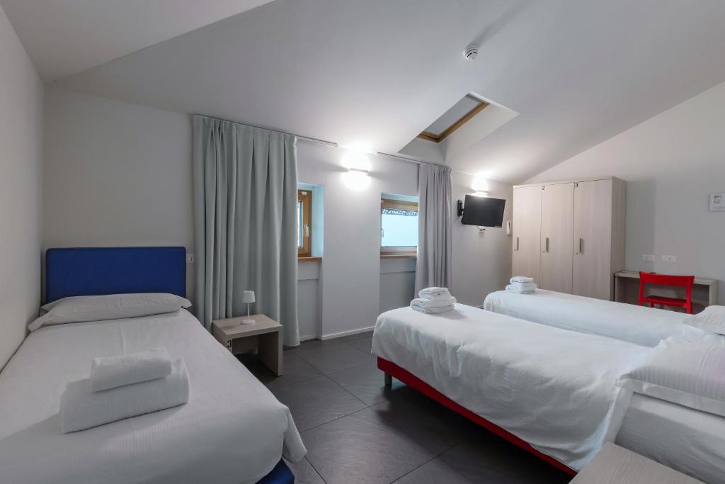 Postel nebo postele na pokoji v ubytování StraVagante Hostel & Rooms