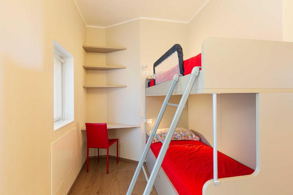 A bed or beds in a room at Pretty home in a resort with pool! - Casa Aurora