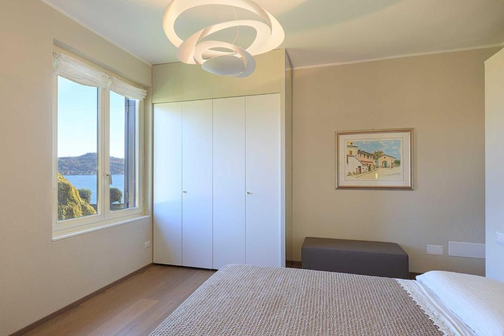 A bed or beds in a room at Pretty home in a resort with pool! - Casa Aurora
