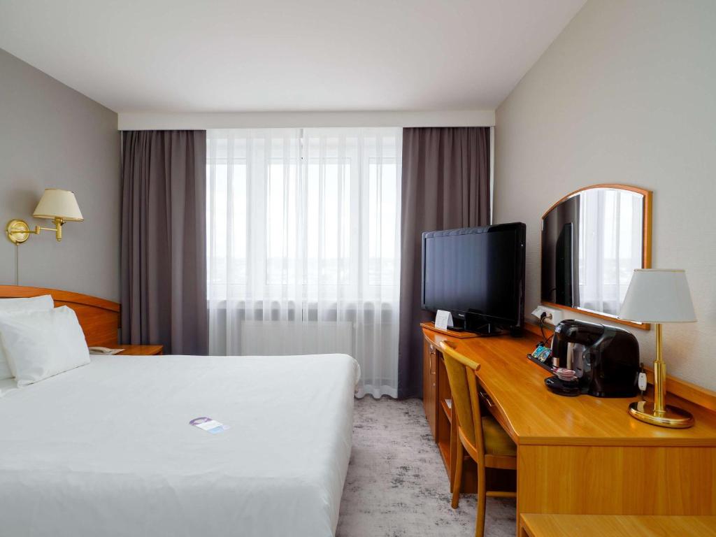 Televízia a/alebo spoločenská miestnosť v ubytovaní Mercure Czestochowa Centrum
