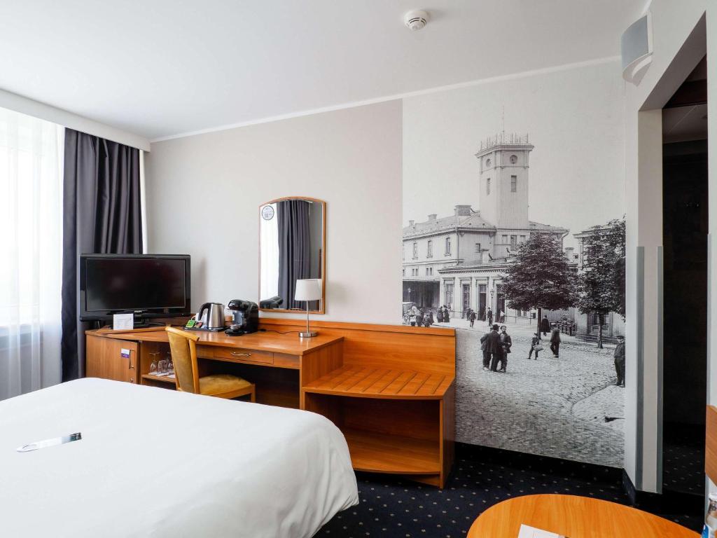 Posteľ alebo postele v izbe v ubytovaní Mercure Czestochowa Centrum