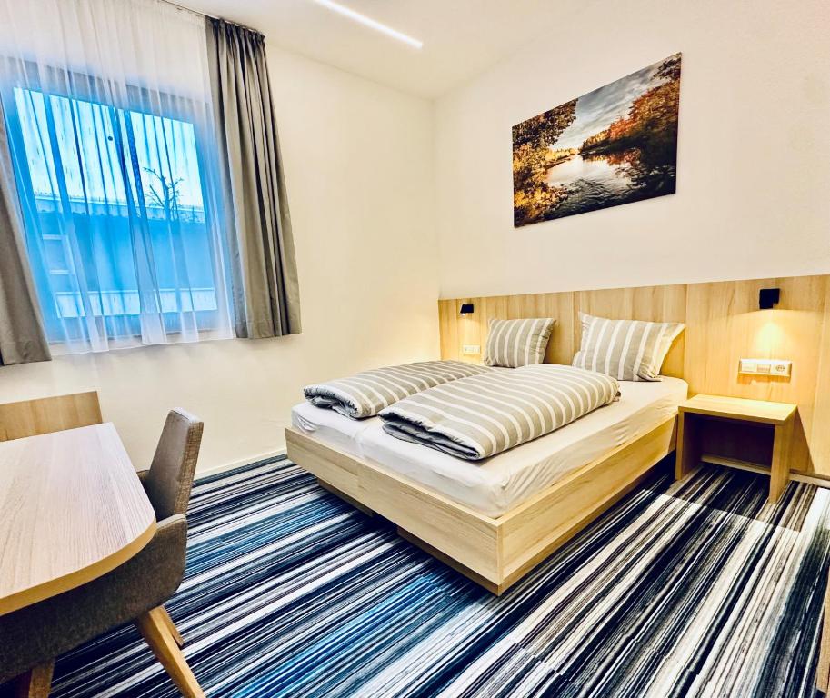 Postel nebo postele na pokoji v ubytování Hotel Lumi