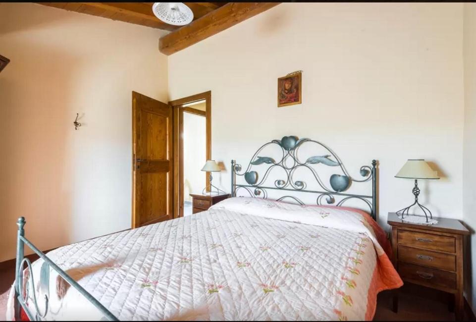Łóżko lub łóżka w pokoju w obiekcie Agriturismo Ca' Bertu'