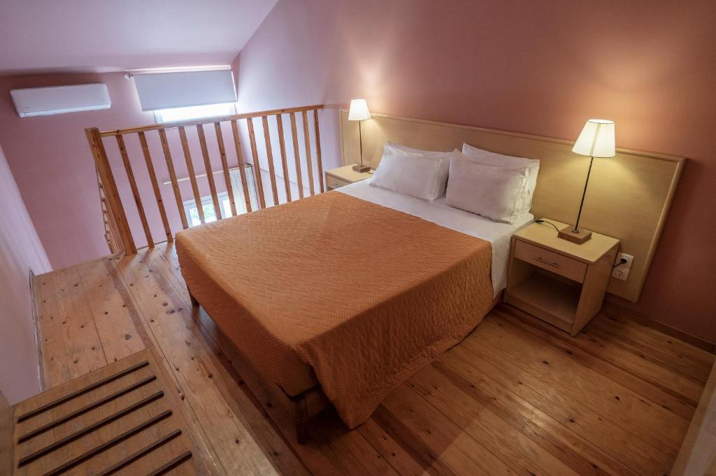 Postel nebo postele na pokoji v ubytování Hotel Coral
