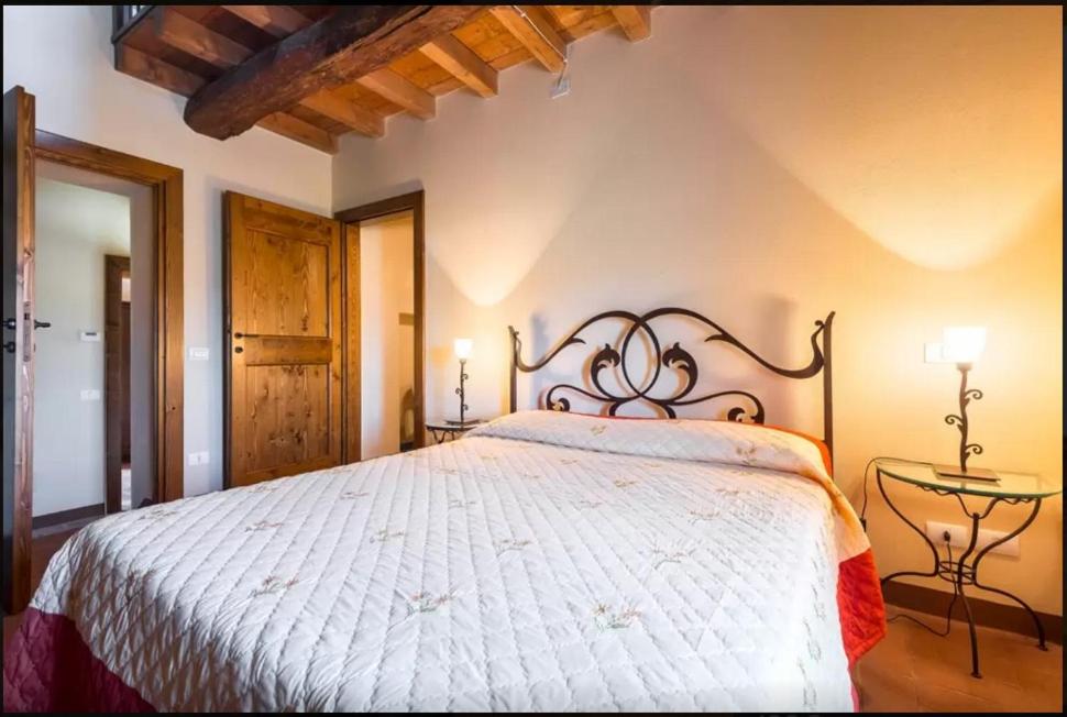 Łóżko lub łóżka w pokoju w obiekcie Agriturismo Ca' Bertu'