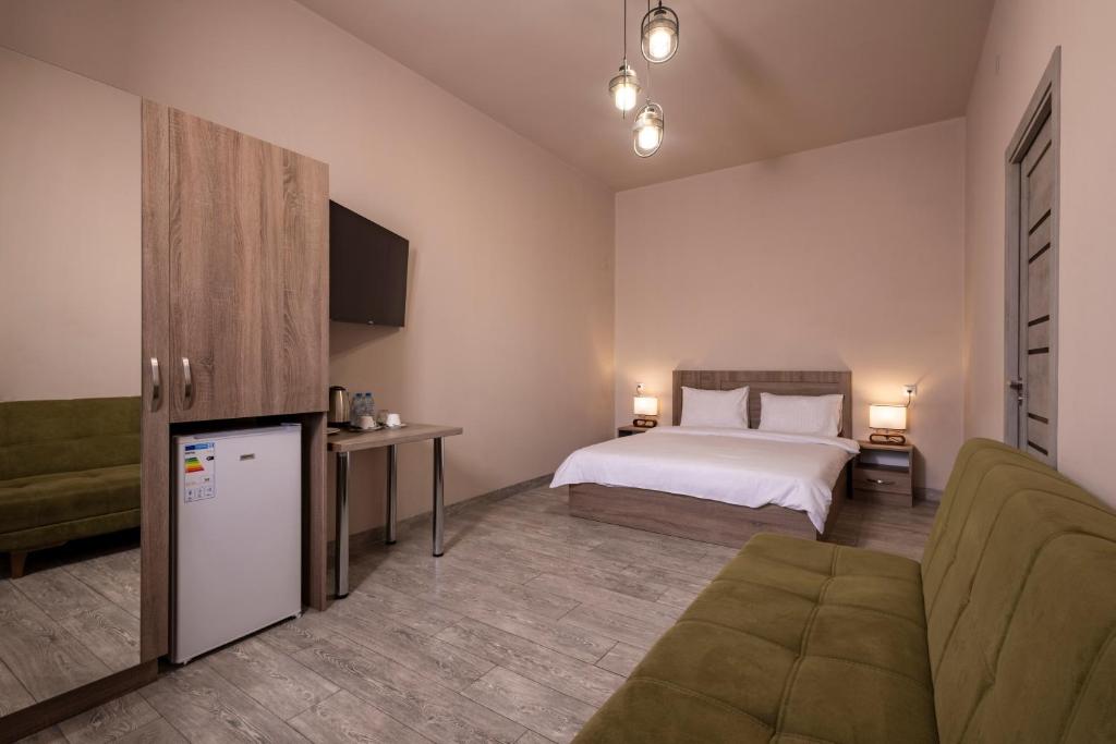 Postel nebo postele na pokoji v ubytování Horizon Hotel Yerevan