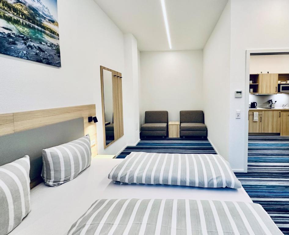 Postel nebo postele na pokoji v ubytování Hotel Lumi