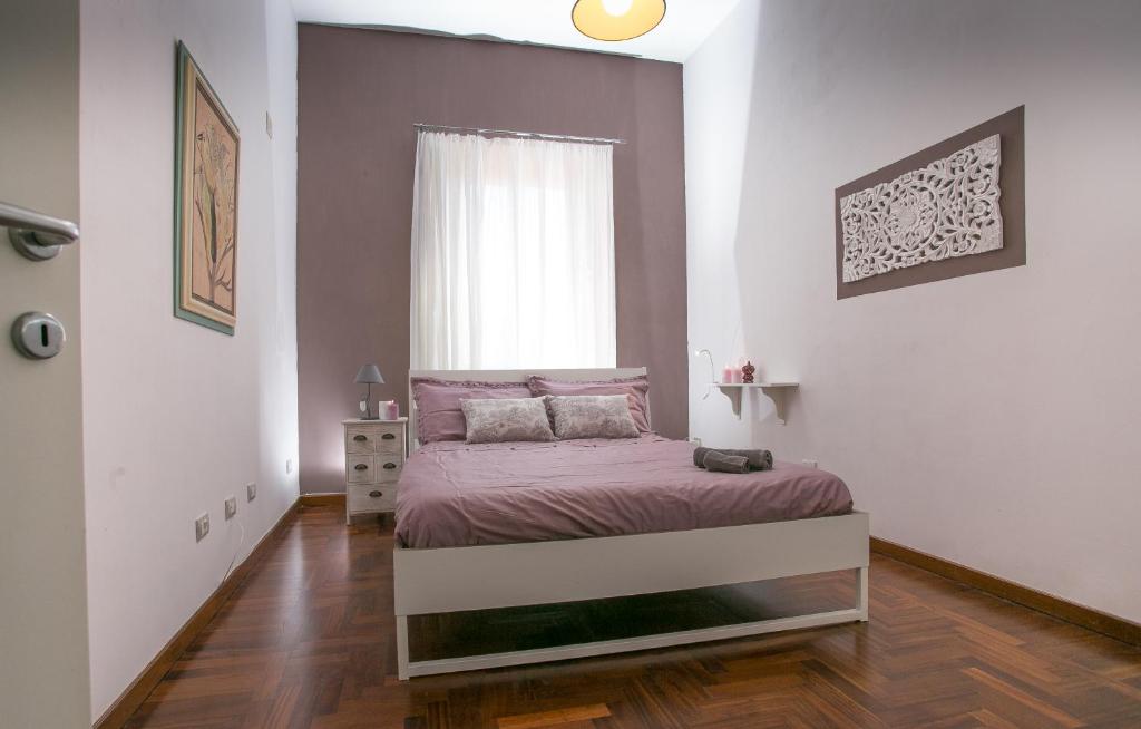 A bed or beds in a room at La finestra sul mare B&B