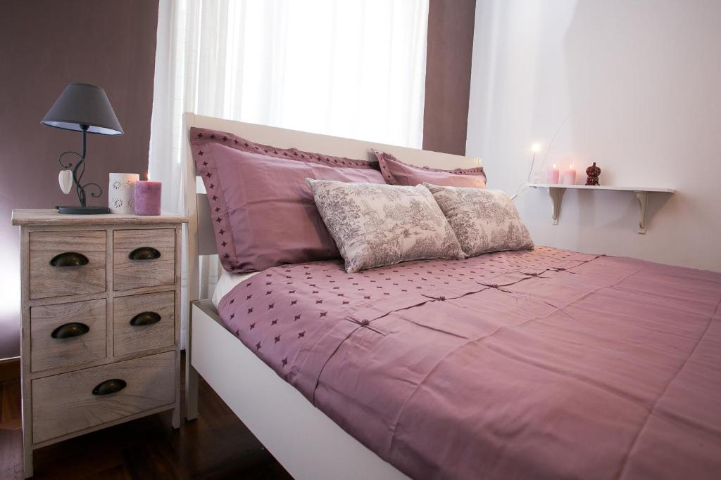 A bed or beds in a room at La finestra sul mare B&B