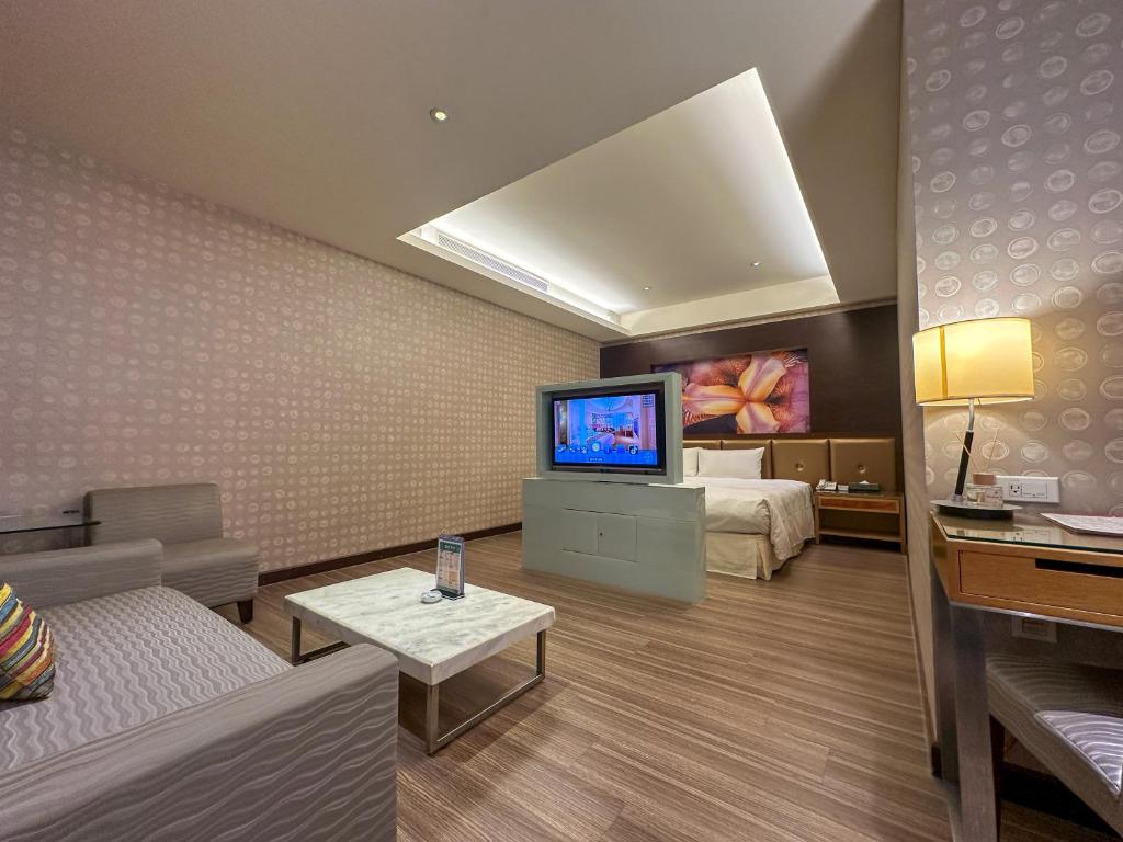 TV a/nebo společenská místnost v ubytování Norway Forest Tamsui Motel