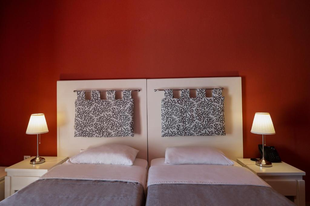 Postel nebo postele na pokoji v ubytování Hotel Coral
