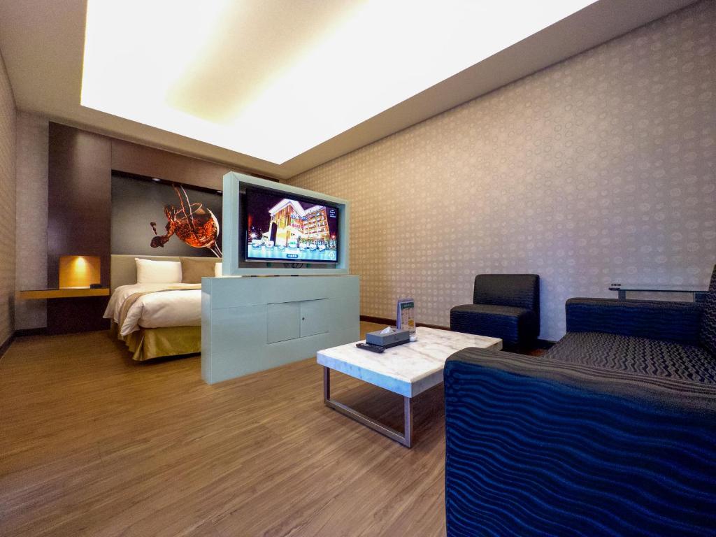 Postel nebo postele na pokoji v ubytování Norway Forest Tamsui Motel