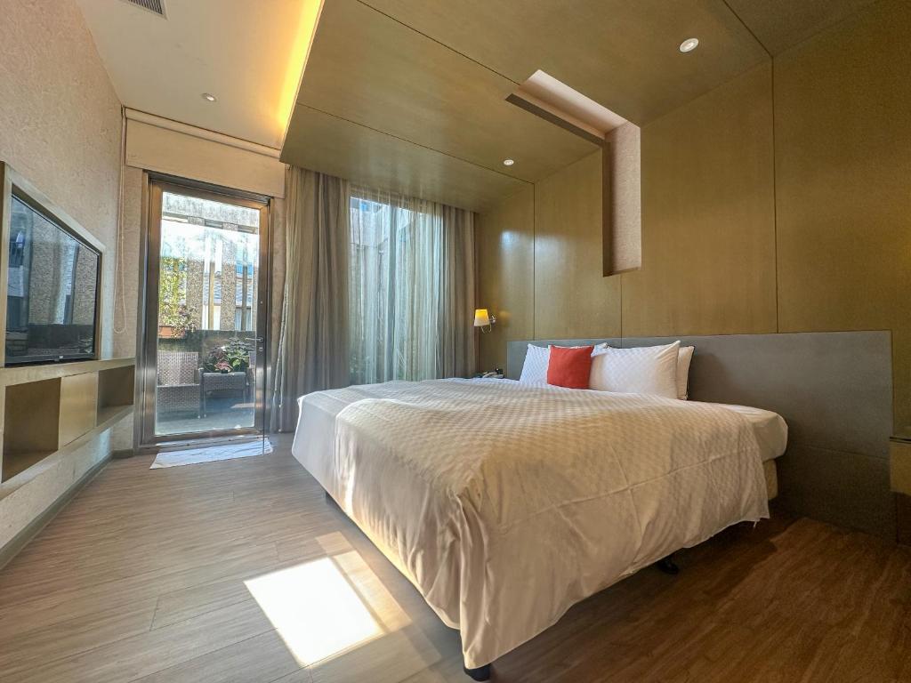 Postel nebo postele na pokoji v ubytování Norway Forest Tamsui Motel