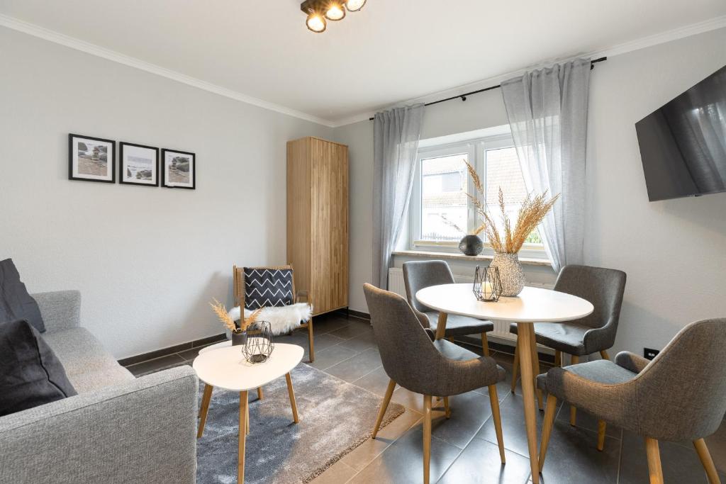 TV a/nebo společenská místnost v ubytování Appartement Merle Kieler Straße 16a APPARTO Grömitz