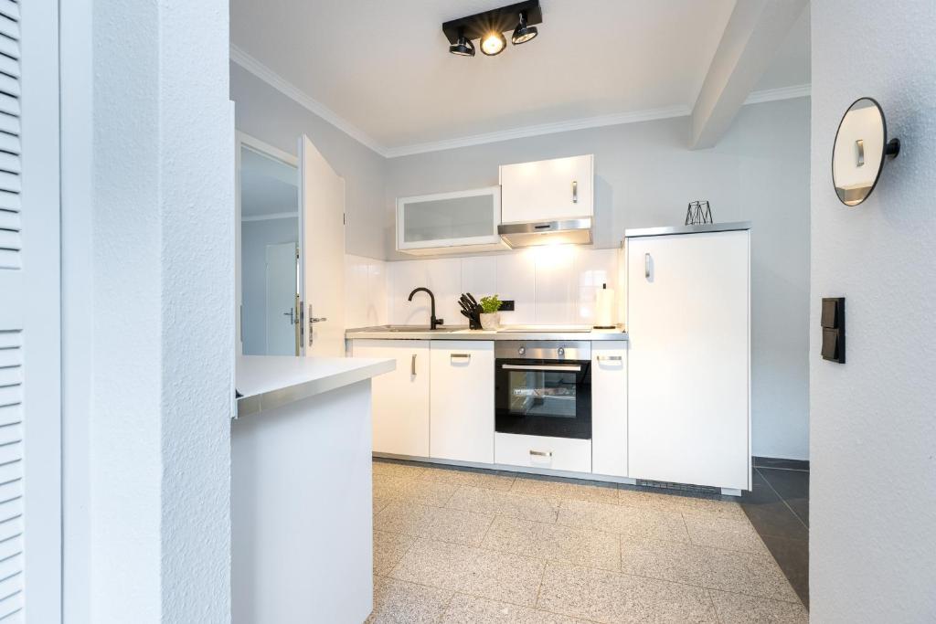 Kuchyň nebo kuchyňský kout v ubytování Appartement Merle Kieler Straße 16a APPARTO Grömitz