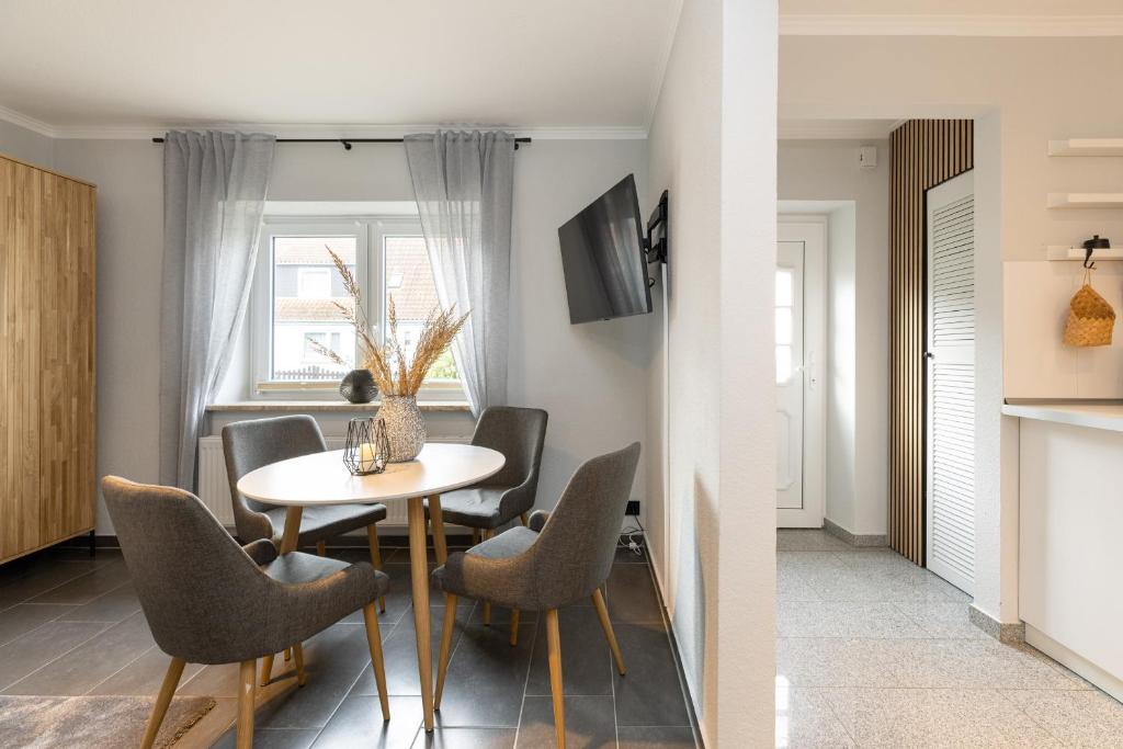 TV a/nebo společenská místnost v ubytování Appartement Merle Kieler Straße 16a APPARTO Grömitz