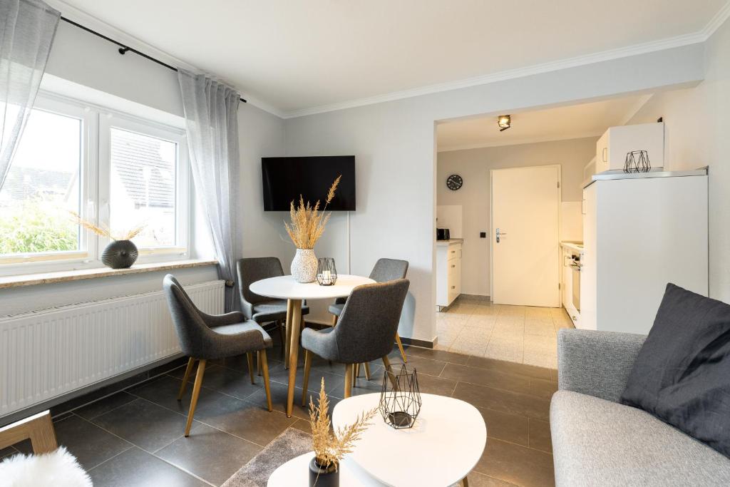 TV a/nebo společenská místnost v ubytování Appartement Merle Kieler Straße 16a APPARTO Grömitz