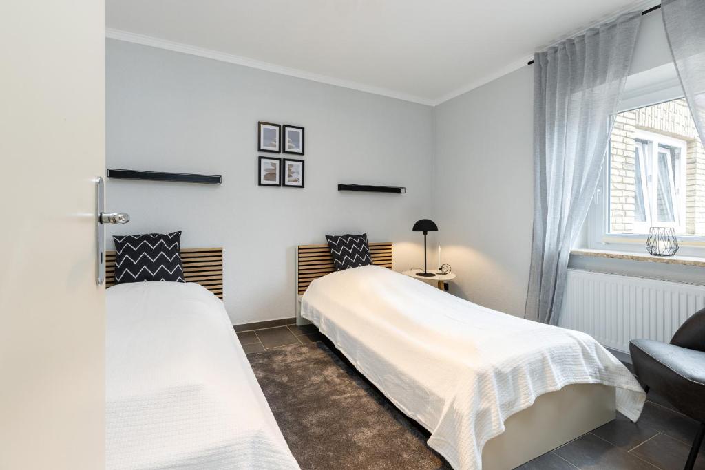 Postel nebo postele na pokoji v ubytování Appartement Merle Kieler Straße 16a APPARTO Grömitz