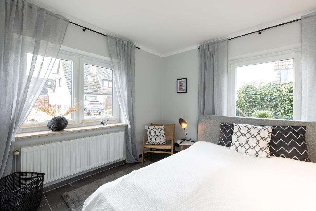 Postel nebo postele na pokoji v ubytování Appartement Merle Kieler Straße 16a APPARTO Grömitz