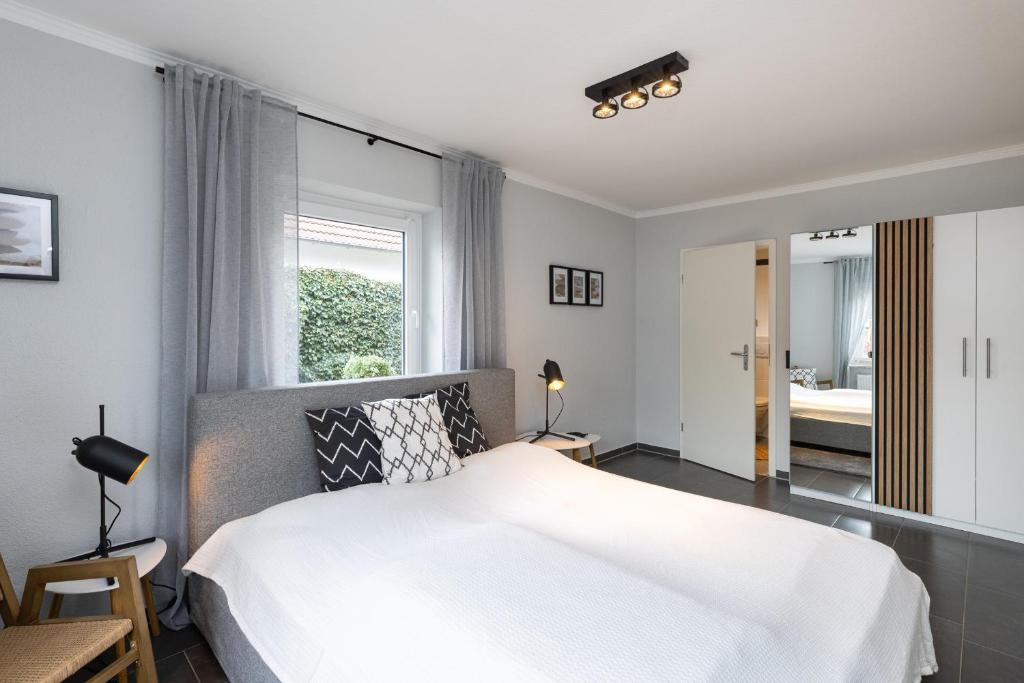 Postel nebo postele na pokoji v ubytování Appartement Merle Kieler Straße 16a APPARTO Grömitz