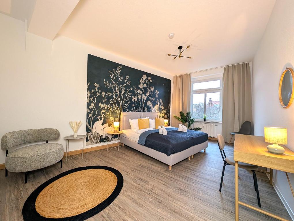 En eller flere senge i et værelse på BohnApartments Stauffenberg City - Parkplatz - 2 Badezimmer - 3 Schlafzimmer - WLAN