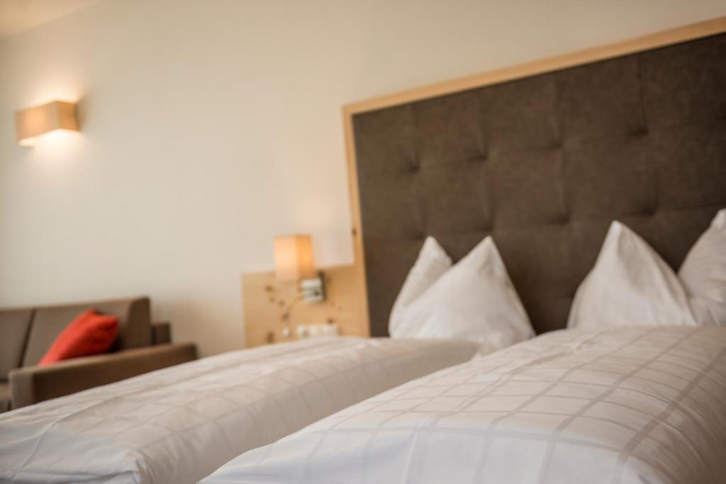 Postel nebo postele na pokoji v ubytování Hotel Schmiedhof