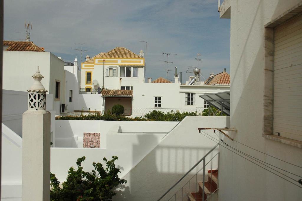 a view of the roofs of white buildings at Casa Delgado in Tavira