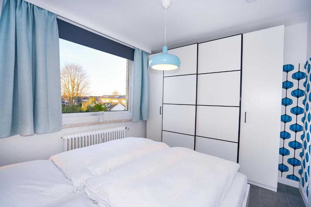Postel nebo postele na pokoji v ubytování Haus Baltic App 114