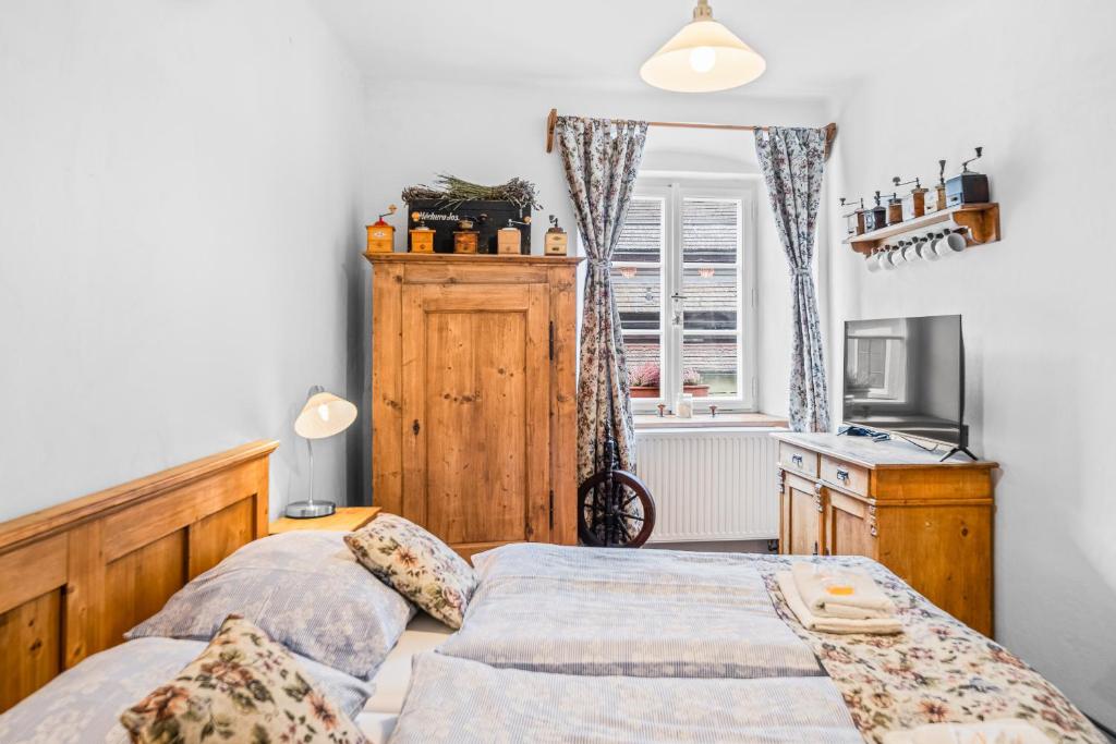 Postel nebo postele na pokoji v ubytování Apartmány Krumlov