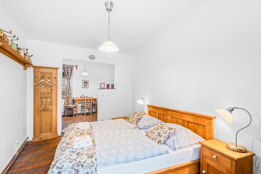 Postel nebo postele na pokoji v ubytování Apartmány Krumlov