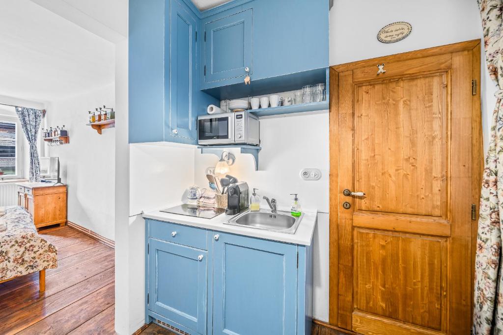 Kuchyň nebo kuchyňský kout v ubytování Apartmány Krumlov