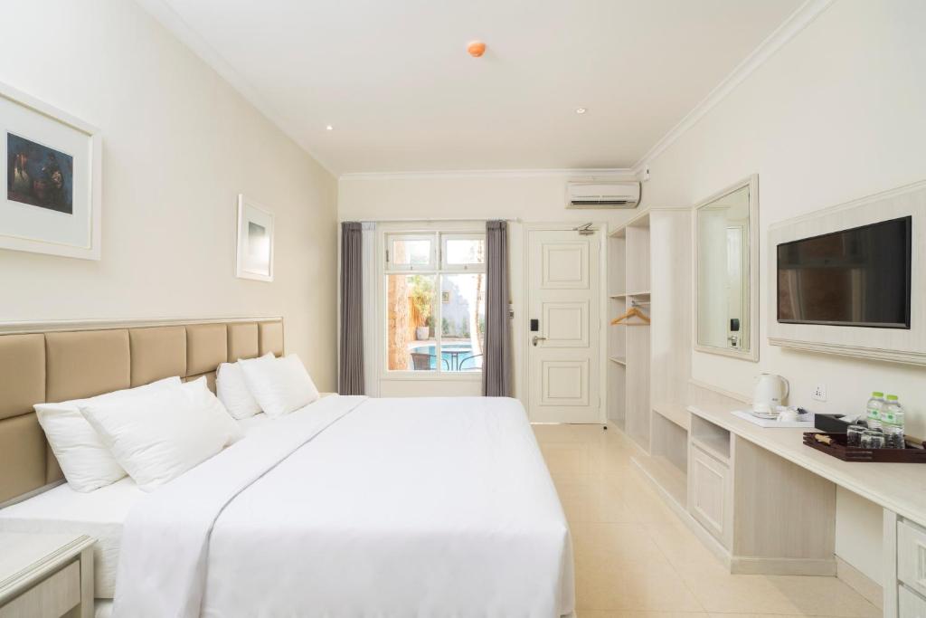Postel nebo postele na pokoji v ubytování Alron Hotel Kuta