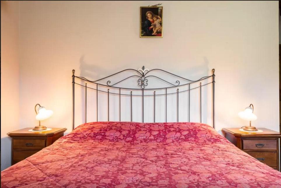Łóżko lub łóżka w pokoju w obiekcie Agriturismo Ca' Bertu'