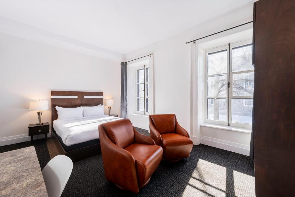 Postel nebo postele na pokoji v ubytování Hôtel Sainte-Anne