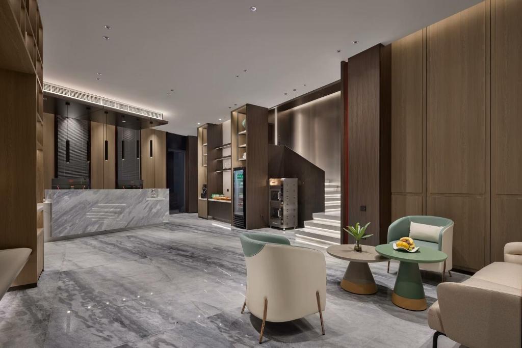 Posezení v ubytování Wenzhou wumajie all-weather hotel shamao river branch - located in the city center pedestrian street with breakfast coffee afternoon tea free laundry drying service free gym free daily necessities free wifi tourist attractions hotel recommendation