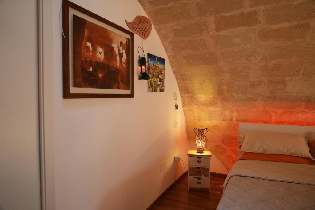 Postel nebo postele na pokoji v ubytování Il Risveglio nei Sassi