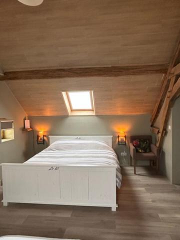 Postel nebo postele na pokoji v ubytování B&B Chambres d'Hotes Chez Juredieu