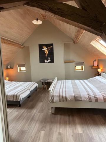 Postel nebo postele na pokoji v ubytování B&B Chambres d'Hotes Chez Juredieu