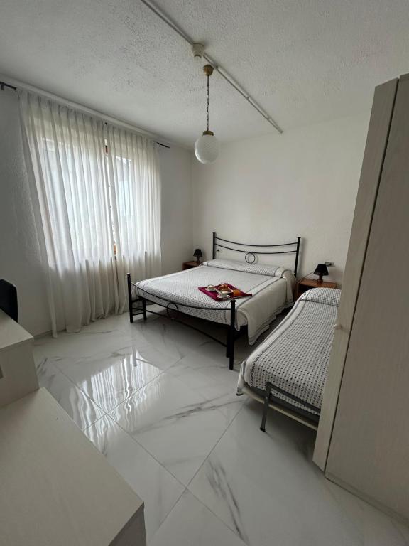 Łóżko lub łóżka w pokoju w obiekcie Hotel Belvedere