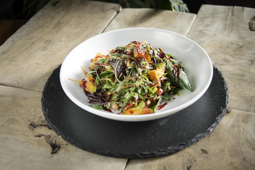 a salad in a white bowl on a table at Cork International Hotel in Cork
