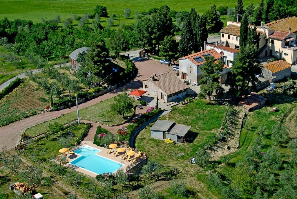 an aerial view of a house with a swimming pool at Agriturismo Signorini in Orciatico