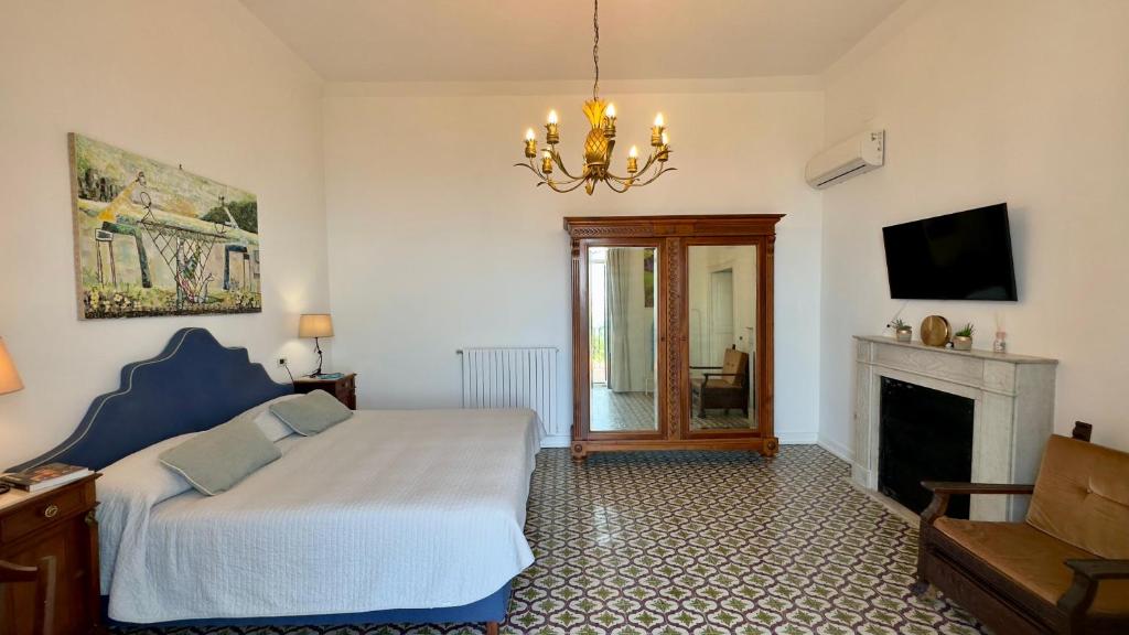 TV a/nebo společenská místnost v ubytování Villa Mundis Relais