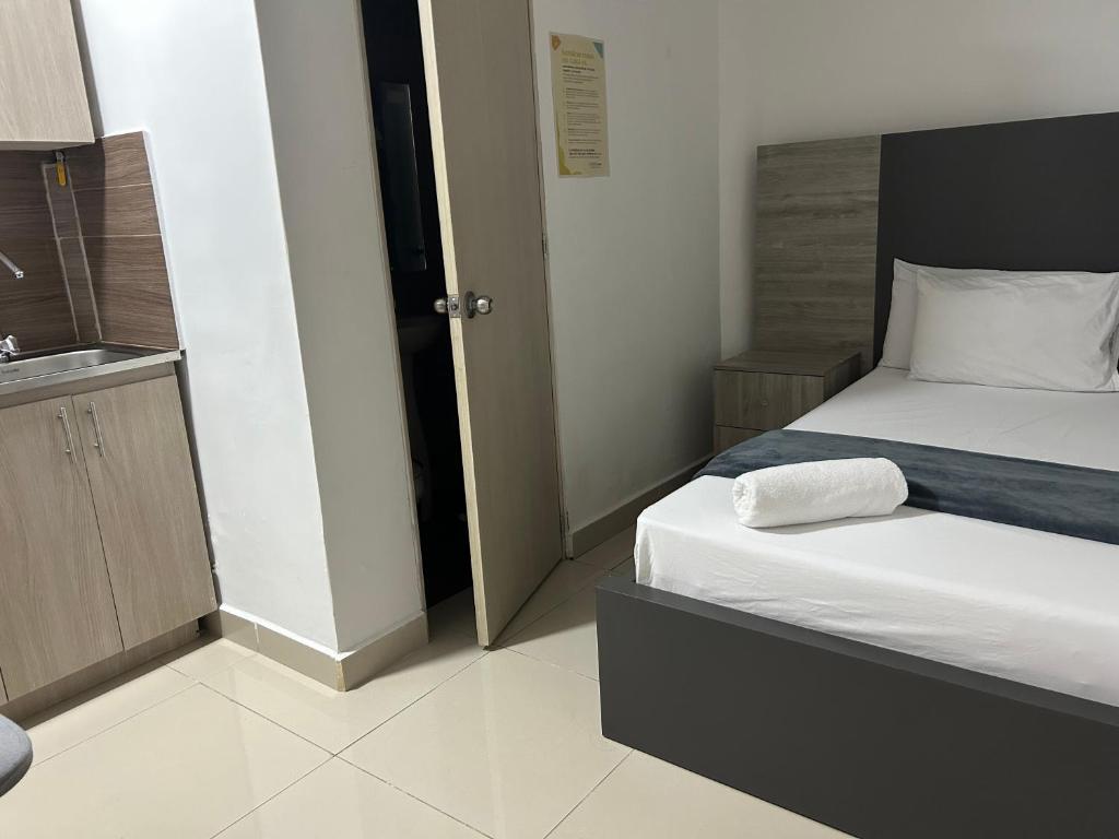 Postel nebo postele na pokoji v ubytování Hotel Ciento Once Boutique Laureles