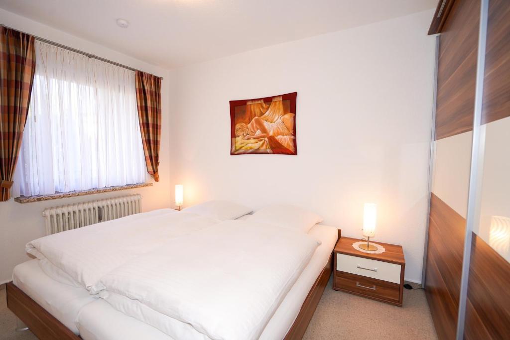 Postel nebo postele na pokoji v ubytování Haus Deichgraf Whg 2
